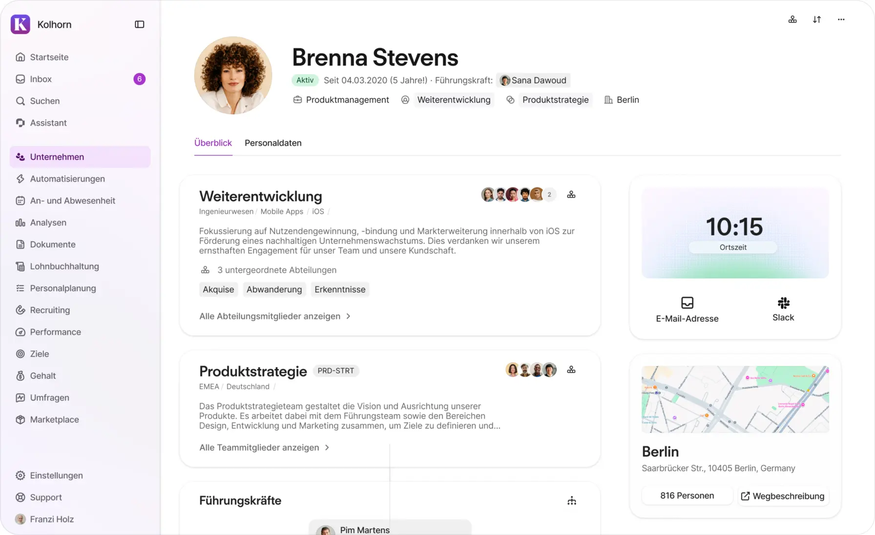 Personio zeigt ein Mitarbeiterprofil mit Abteilung, Führungskräften und Organisationsstruktur in deutscher Oberfläche.
